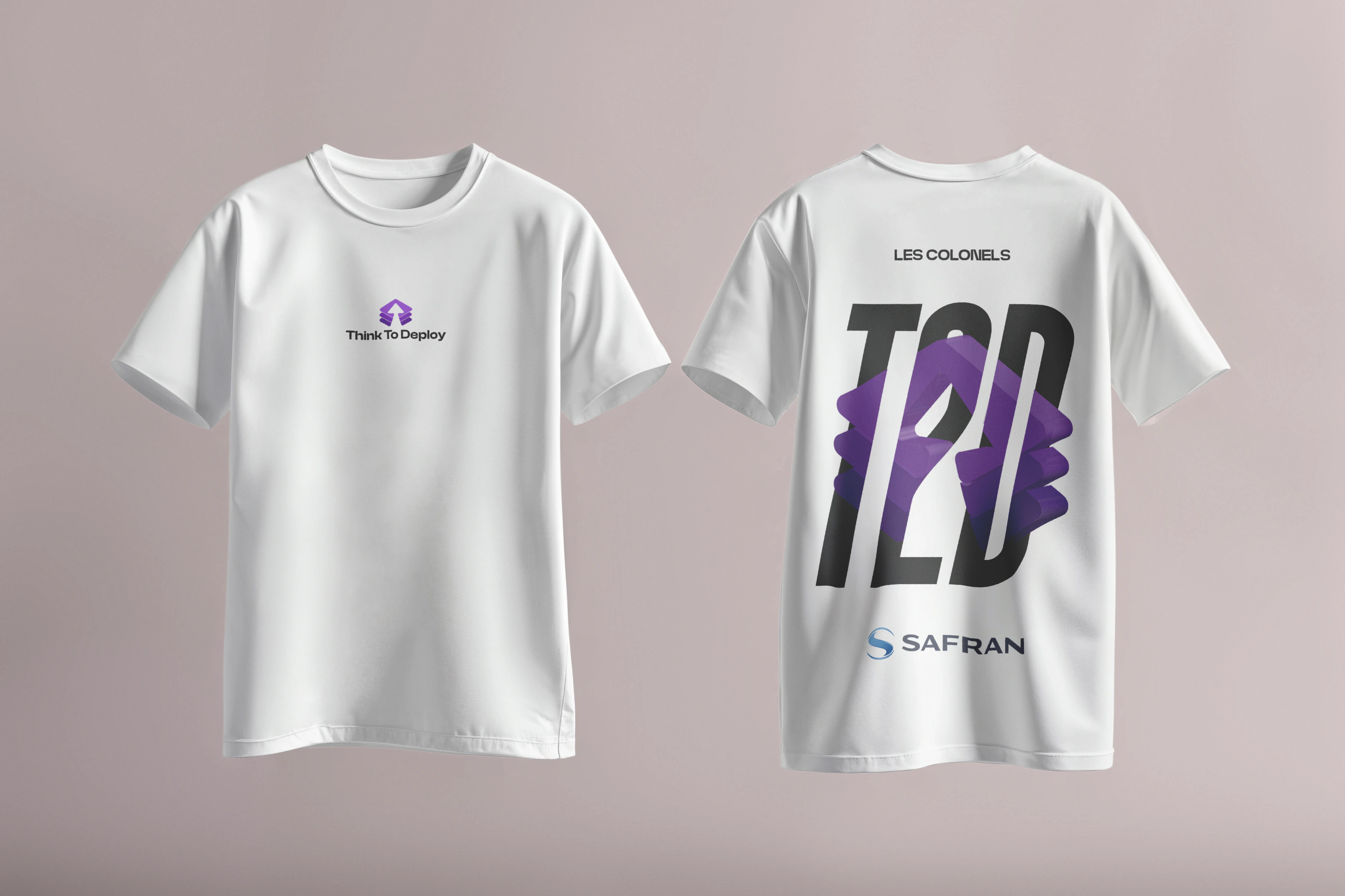 White shirt mockup showing a small violet chest mark and a large layered T2D graphic on the back.